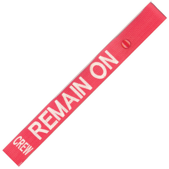 Remain On in White on a Red Bag Tag