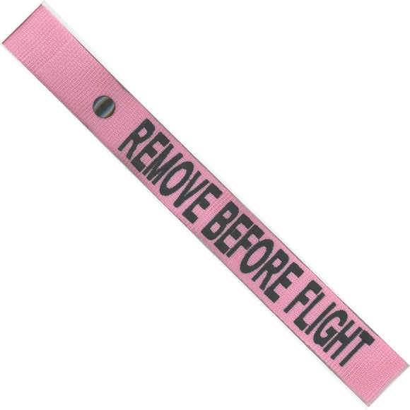 Remove Before Flight in Black on a Pink Bag Tag