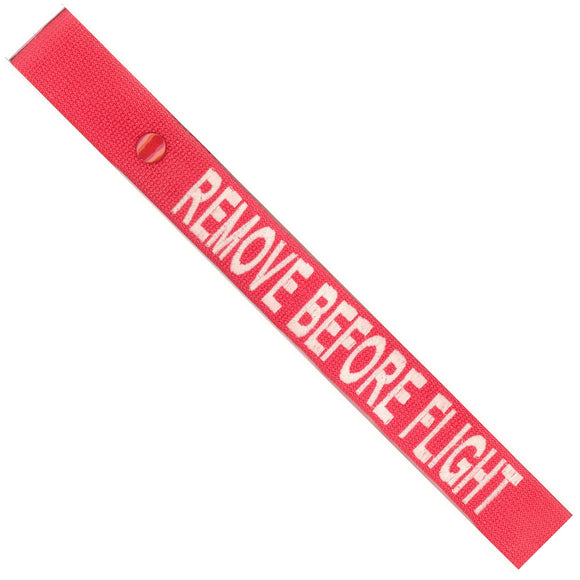 Remove Before Flight in White on a Red Bag Tag